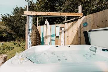 There's a bubbling hot tub and an al fresco shower for magical moments under starlight.