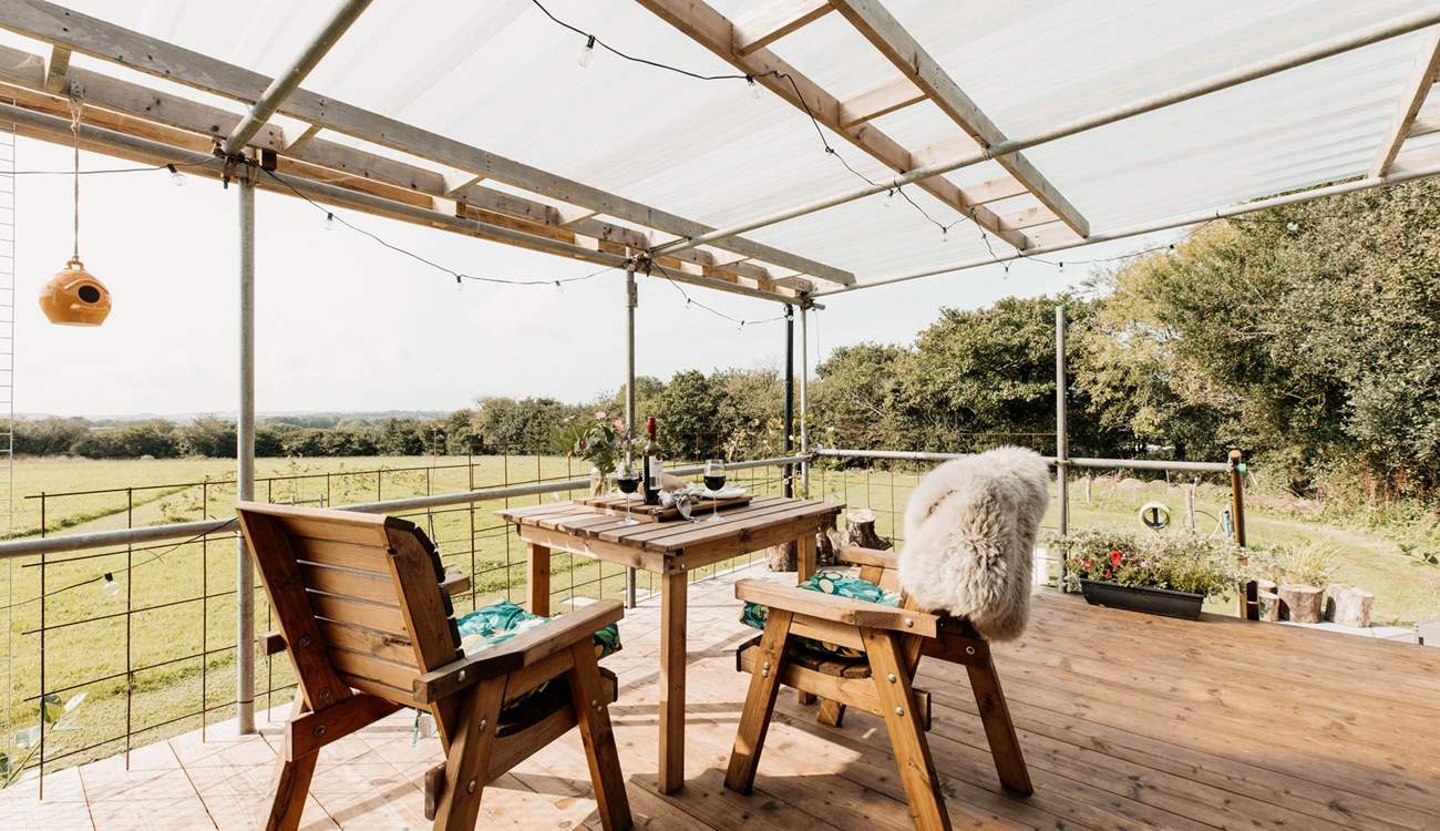 Or outside on the sheltered decking as sunlight seeps through. 