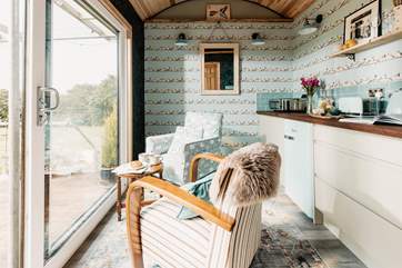 Wholesome interiors adorn the inside space, echoing the natural outside world.