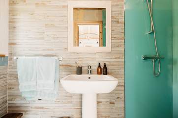 The beautifully presented shower-room sits to the right of the cabin.