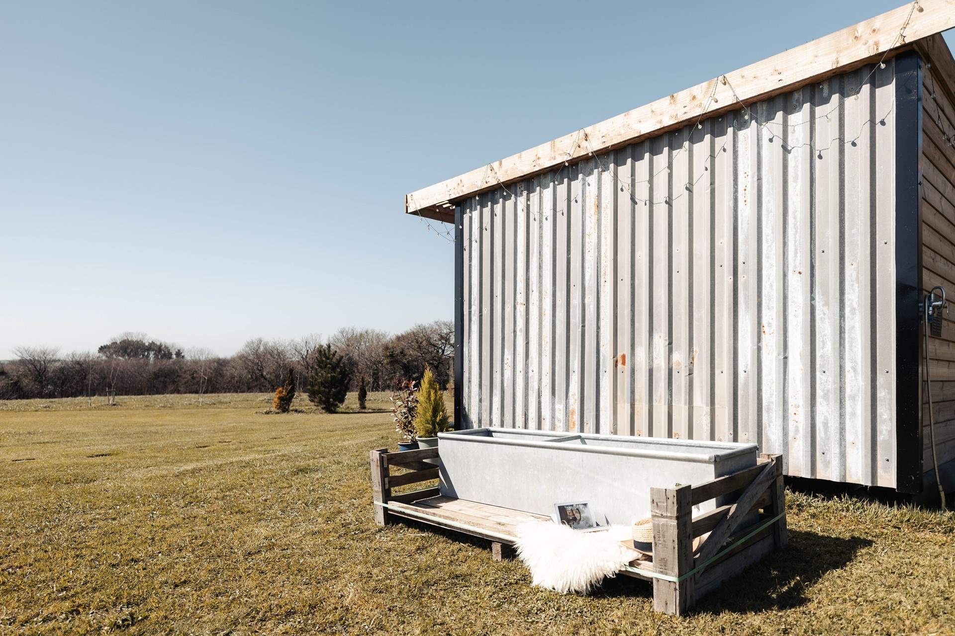 Relax and unwind in the wood-fired sauna and enjoy a dip in the cold water bath. 