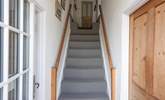 Traditional cottage stairs lead up to the first floor. Please note the two steps up to the double and twin rooms at the top of the stairs and the further two steps which lead up to the bathroom and single room. - Thumbnail Image