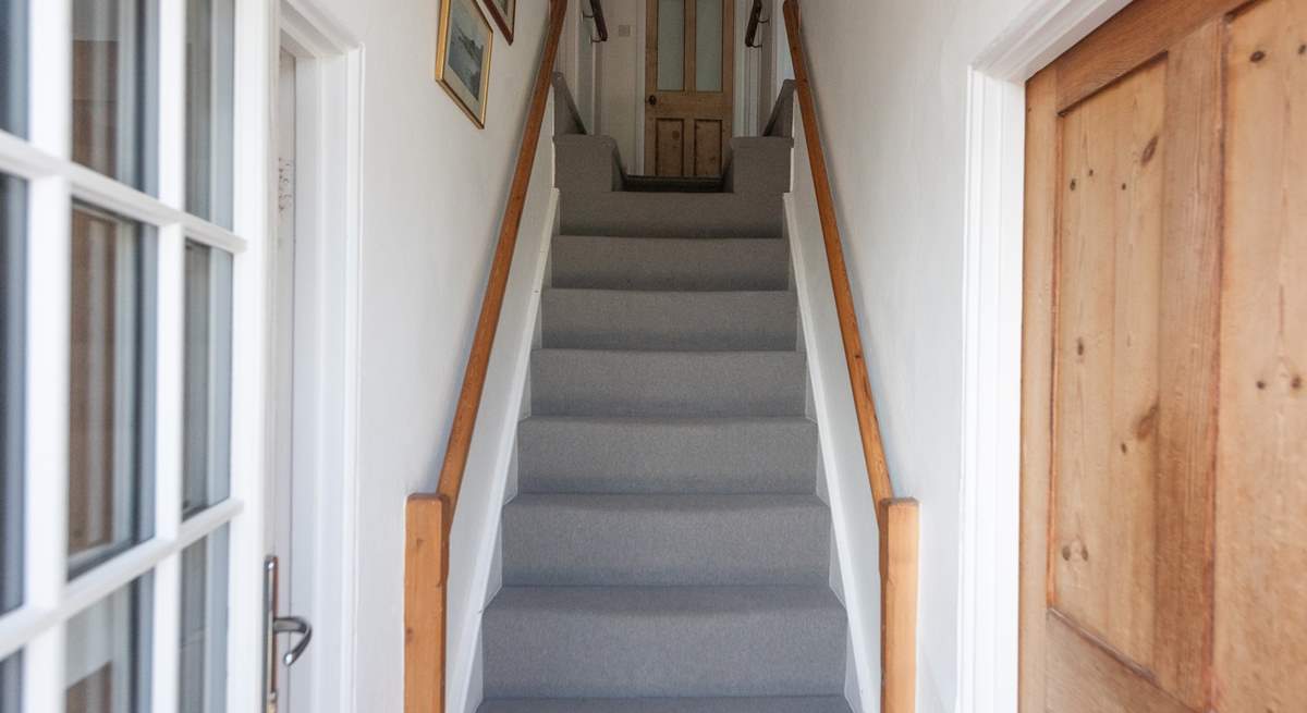 Traditional cottage stairs lead up to the first floor. Please note the two steps up to the double and twin rooms at the top of the stairs and the further two steps which lead up to the bathroom and single room.