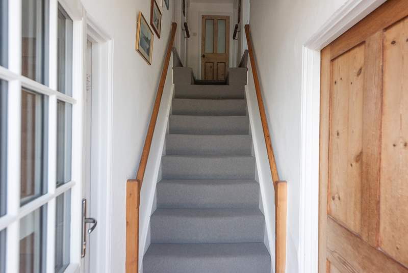 Traditional cottage stairs lead up to the first floor. Please note the two steps up to the double and twin rooms at the top of the stairs and the further two steps which lead up to the bathroom and single room.
