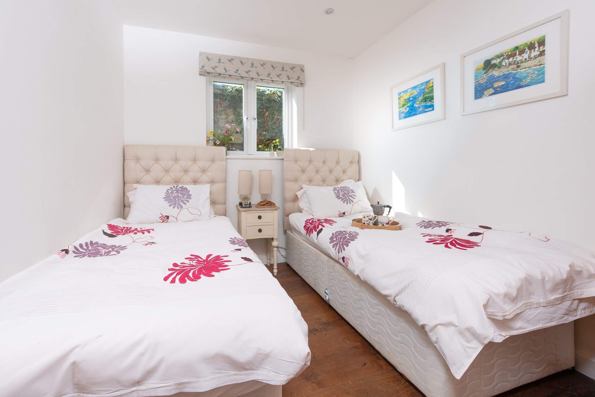 Bedroom 1 is a pretty twin bedroom on the ground floor.