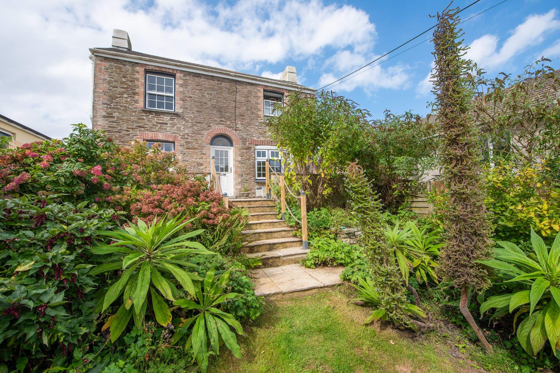 Steps lead down to the garden. 