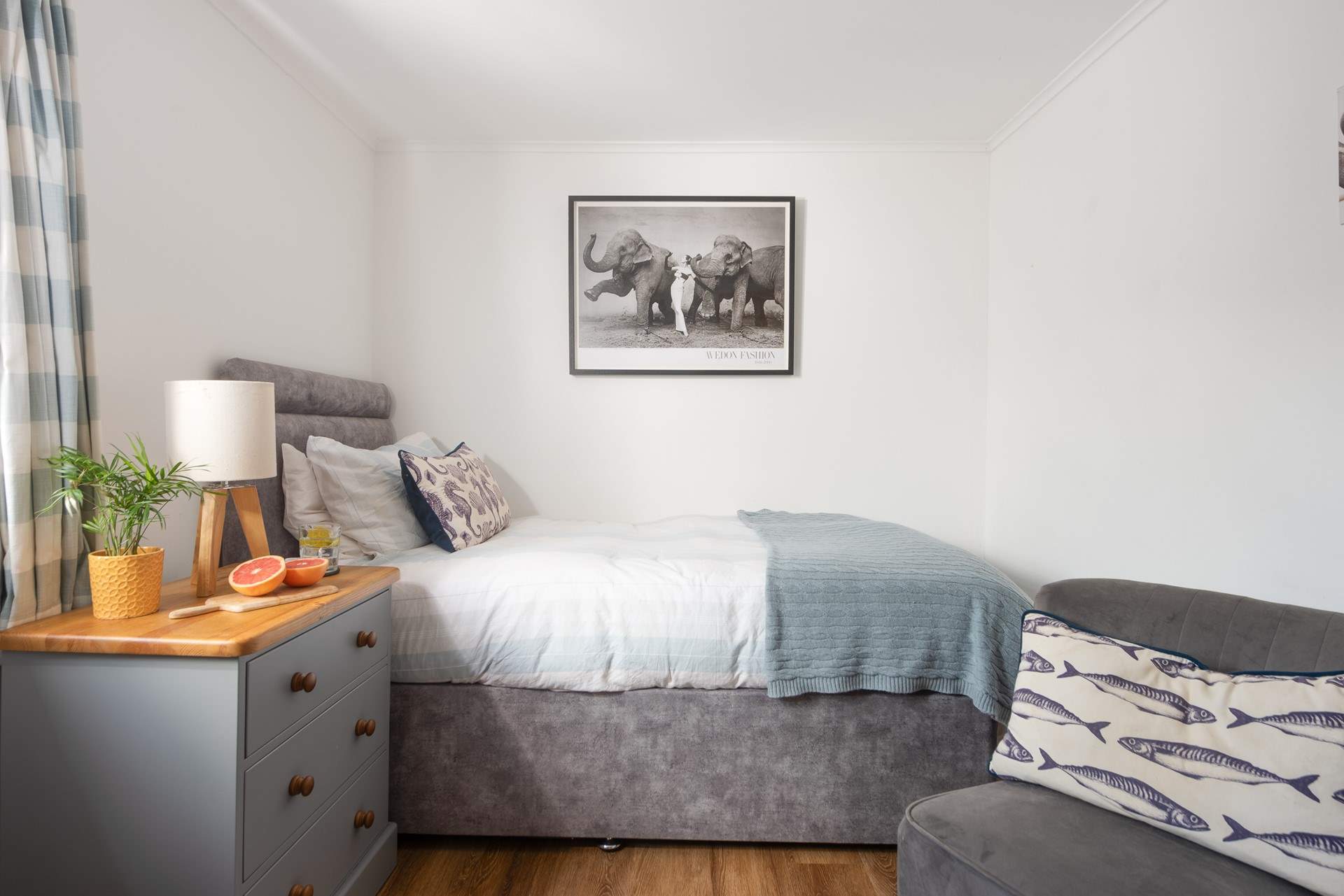 The single room with soft linens and a cosy throw. 