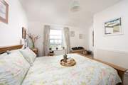 Bedroom 3 on the first floor is light and airy.