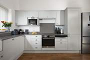The gorgeous kitchen is very well equipped.