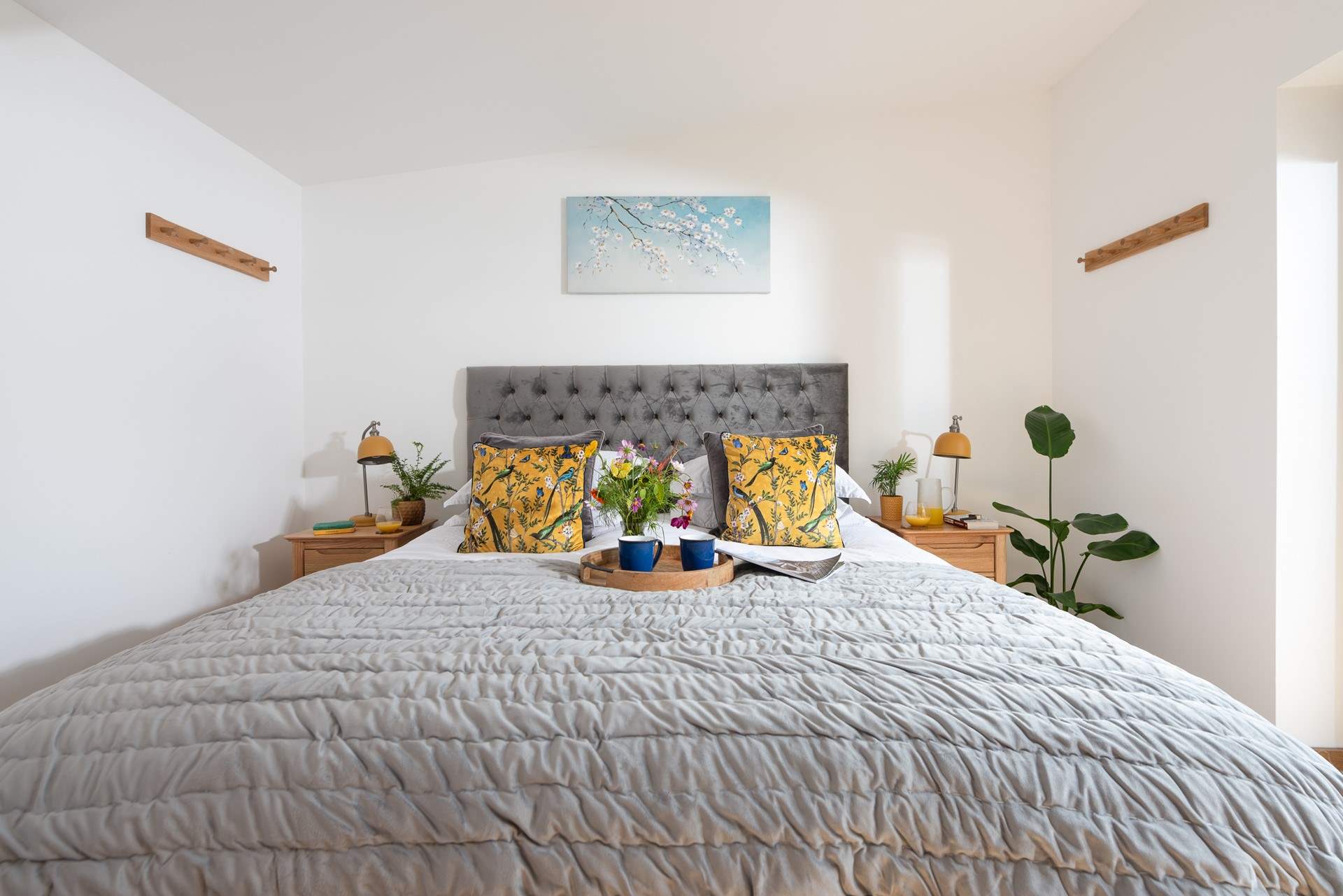 Bedroom one leads out onto the decked patio.