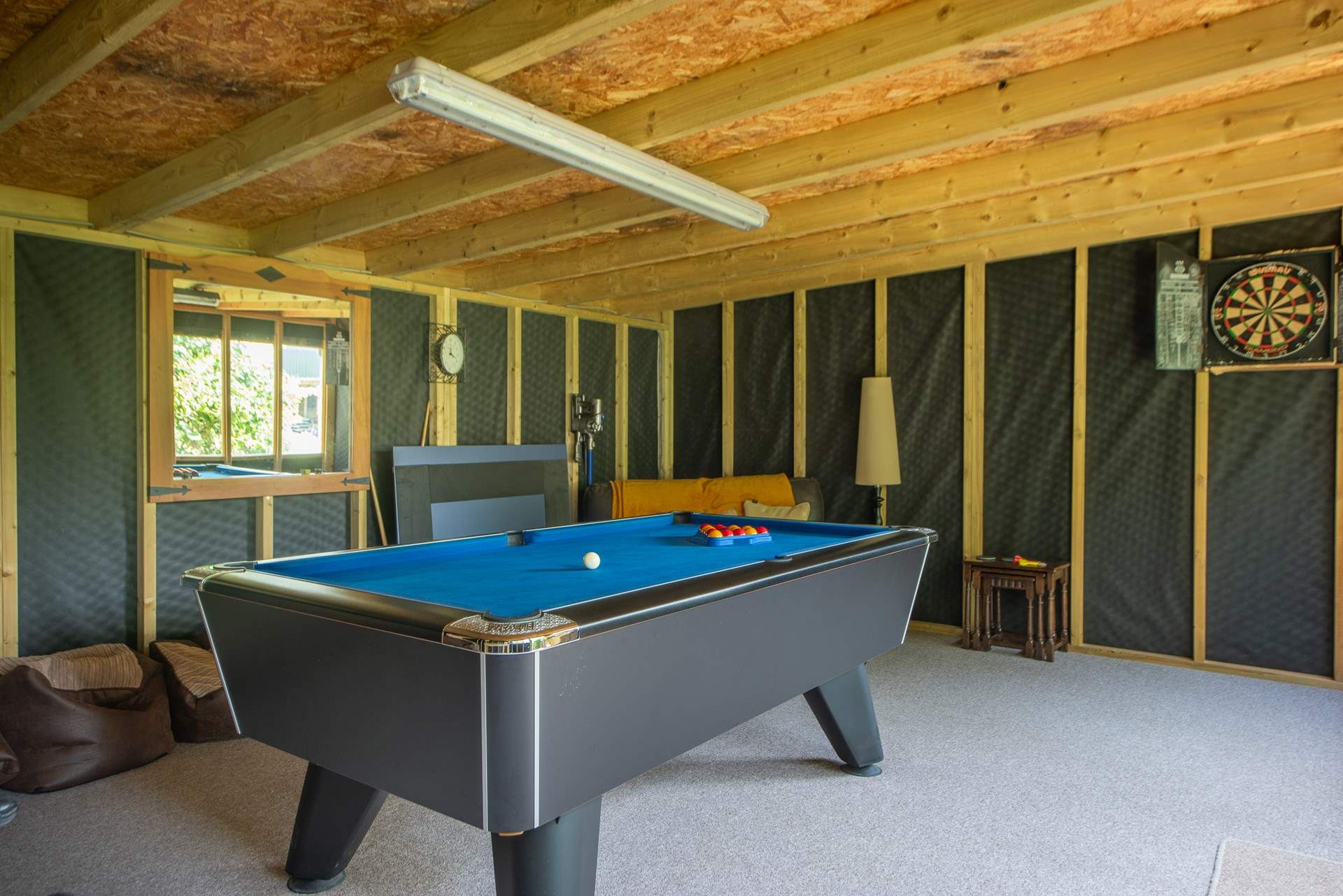 The communal games-room is located near the orchard, just across the country lane from Swallows Rest.