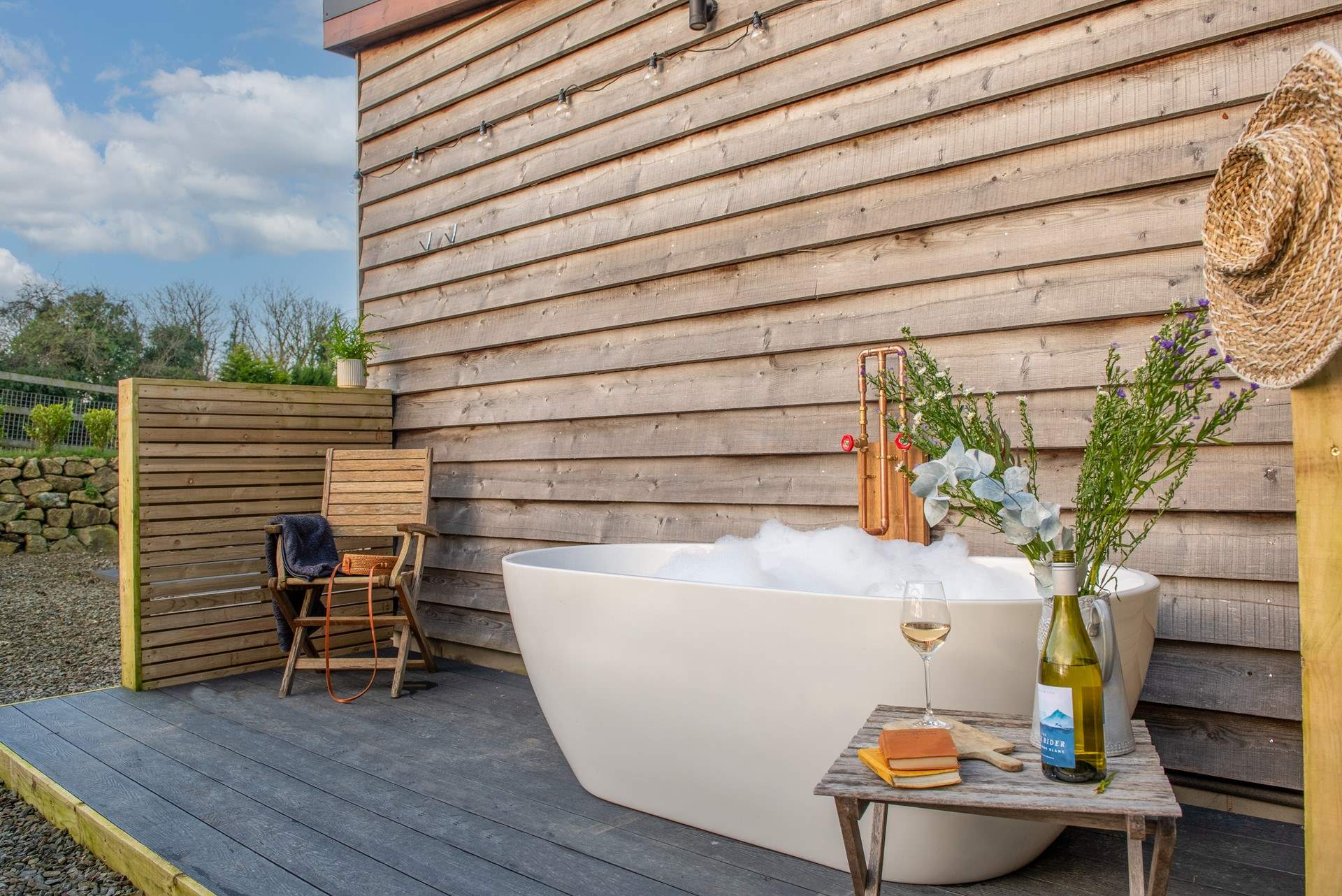 The outside bath is big enough for two.