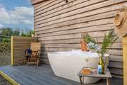 The outside bath is big enough for two.