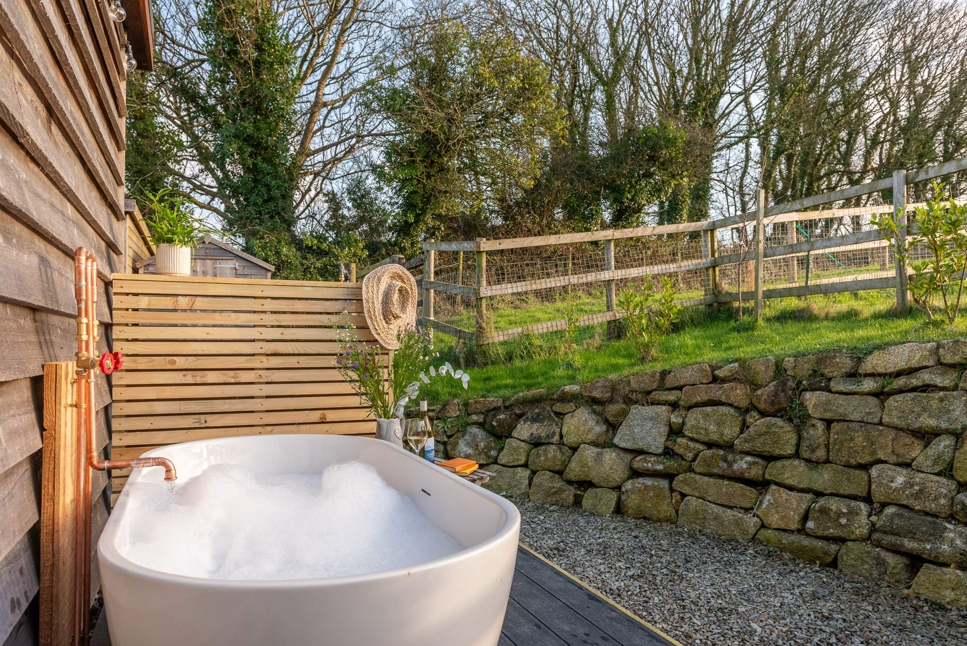 The secluded outdoor bathtub is the perfect place to soak and enjoy the blissful surroundings.