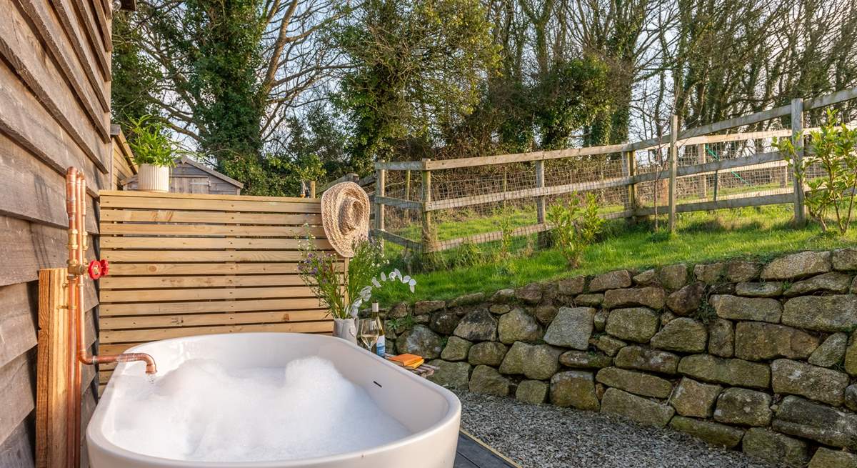 The secluded outdoor bathtub is the perfect place to soak and enjoy the blissful surroundings.