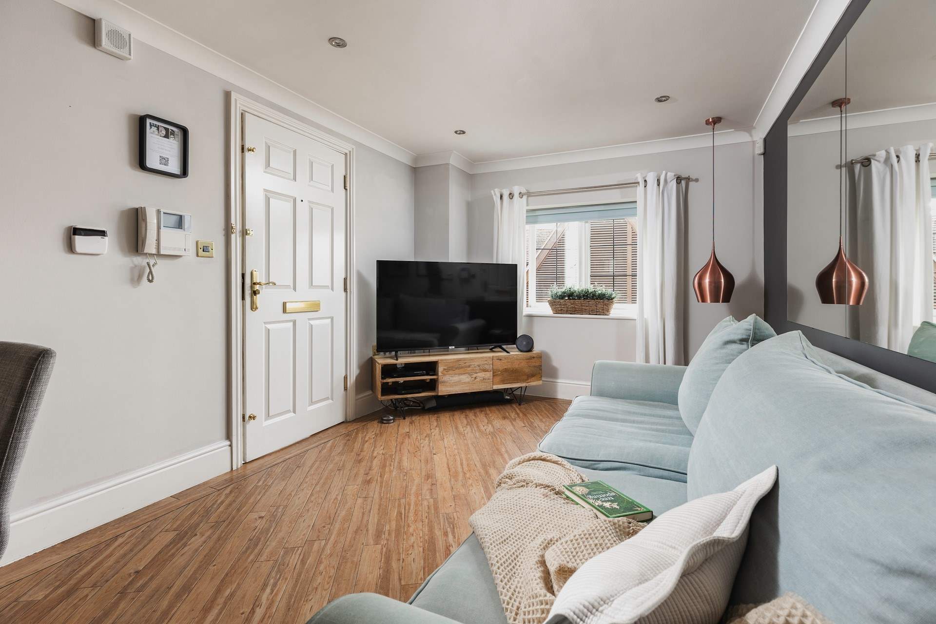 The apartment overlooks Broadway's busy village square.