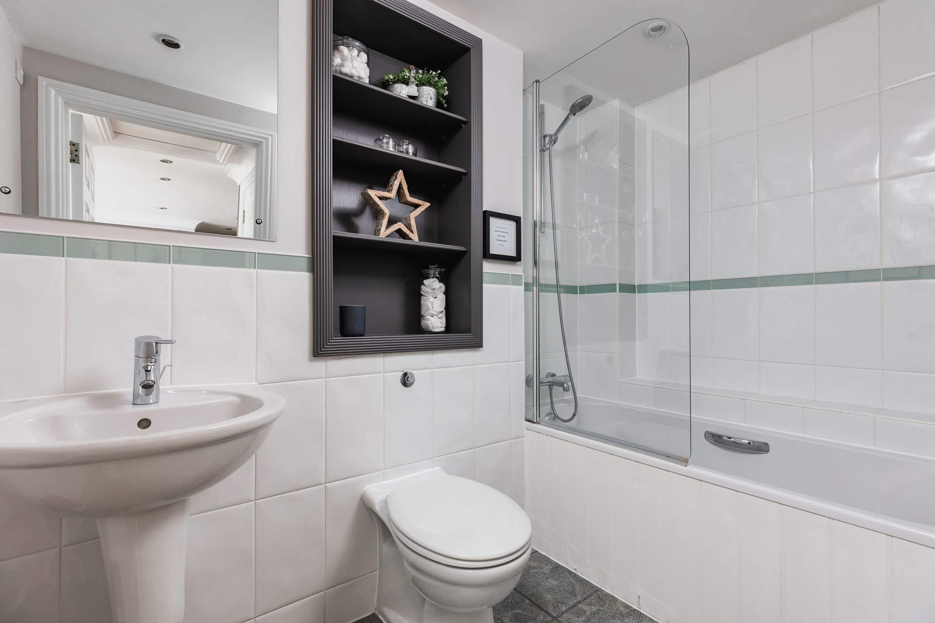 Freshen up in the bright modern bathroom.