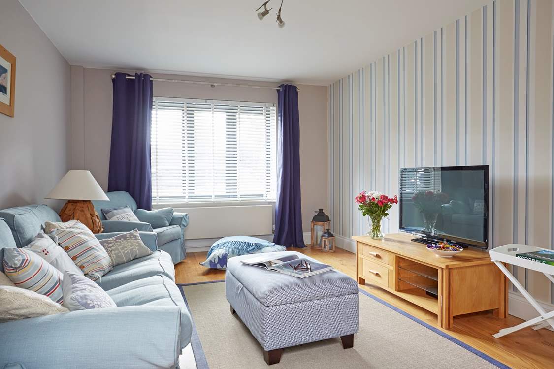 The comfortable sofas in the sitting-room make for a cosy movie night.