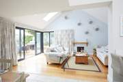The expanse of the living-room can be enjoyed from various aspects of the house.