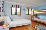 The ground floor bedroom with a small double bed for a teenager or a set of bunk-beds is ideal for the little ones in the party.