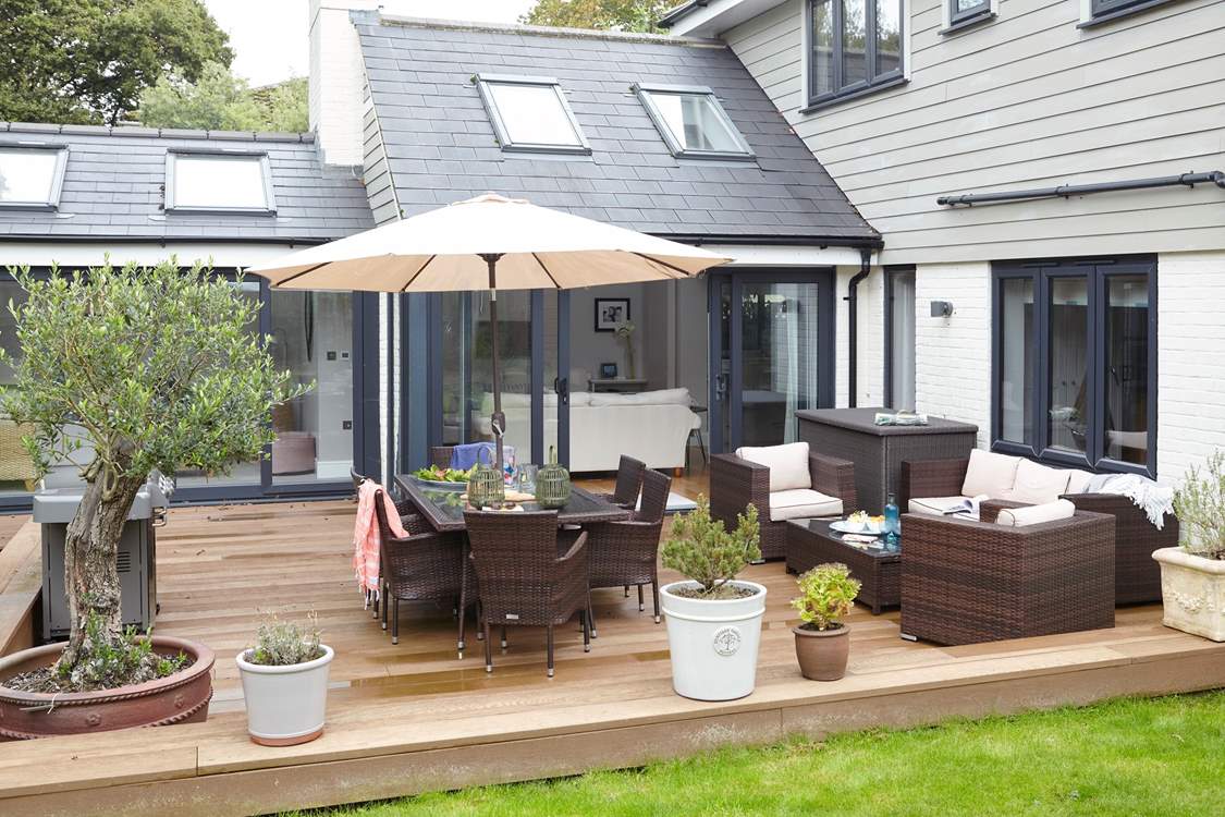 From the gorgeous olive tree to the large Weber grill, the outside space is ideal for those clear nights.