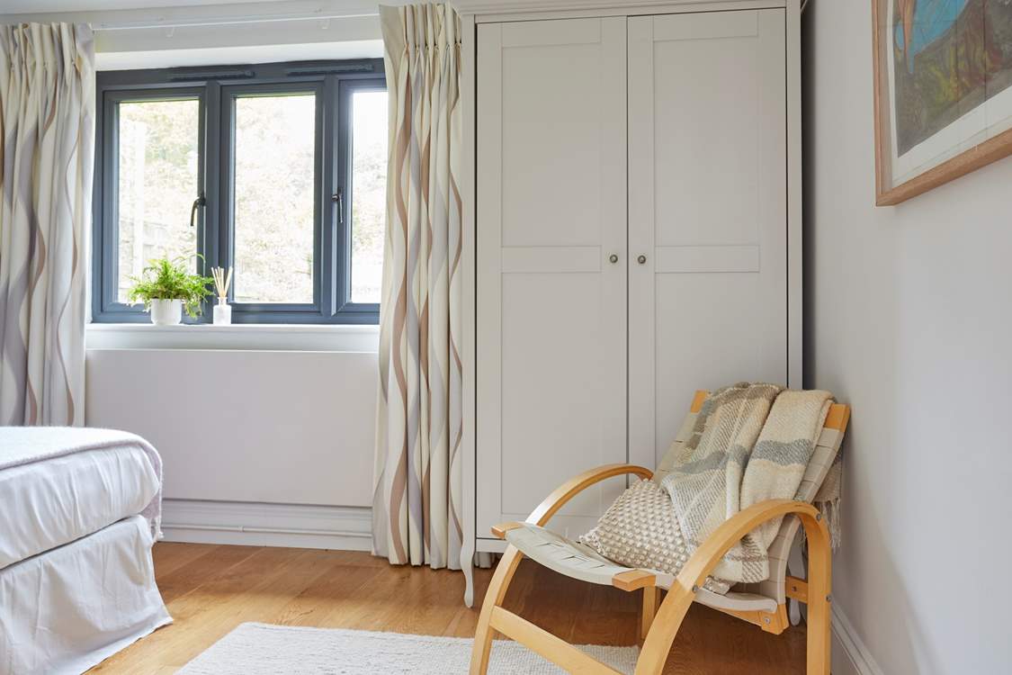 The spacious bedrooms on the ground floor. Bedroom one with reclining chair.