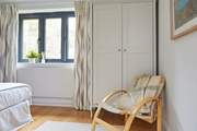 The spacious bedrooms on the ground floor. Bedroom one with reclining chair.