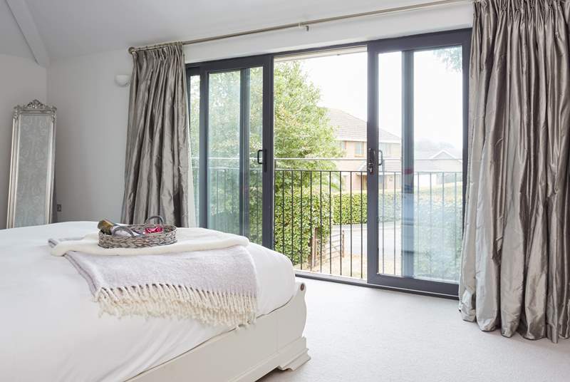 Open the doors and greet the day on your Juliet balcony in the main bedroom with a view to the front of the house.