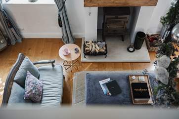 The mezzanine looks down to the cosy living area.