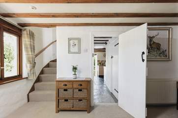 Head along the hall passing the downstairs shower-room and you will discover the sitting-room. From the sitting room head up the stairs to the bedrooms and family bathroom.