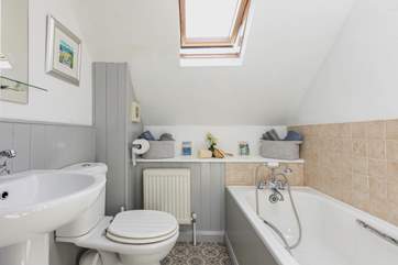 The family bathroom sits on the landing between both of the bedrooms.