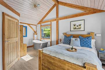 When a bedroom enjoys a free-standing bath, need we say more.