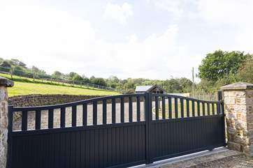 Arrive at the electric gate and follow your private drive to Buzzards Rise.