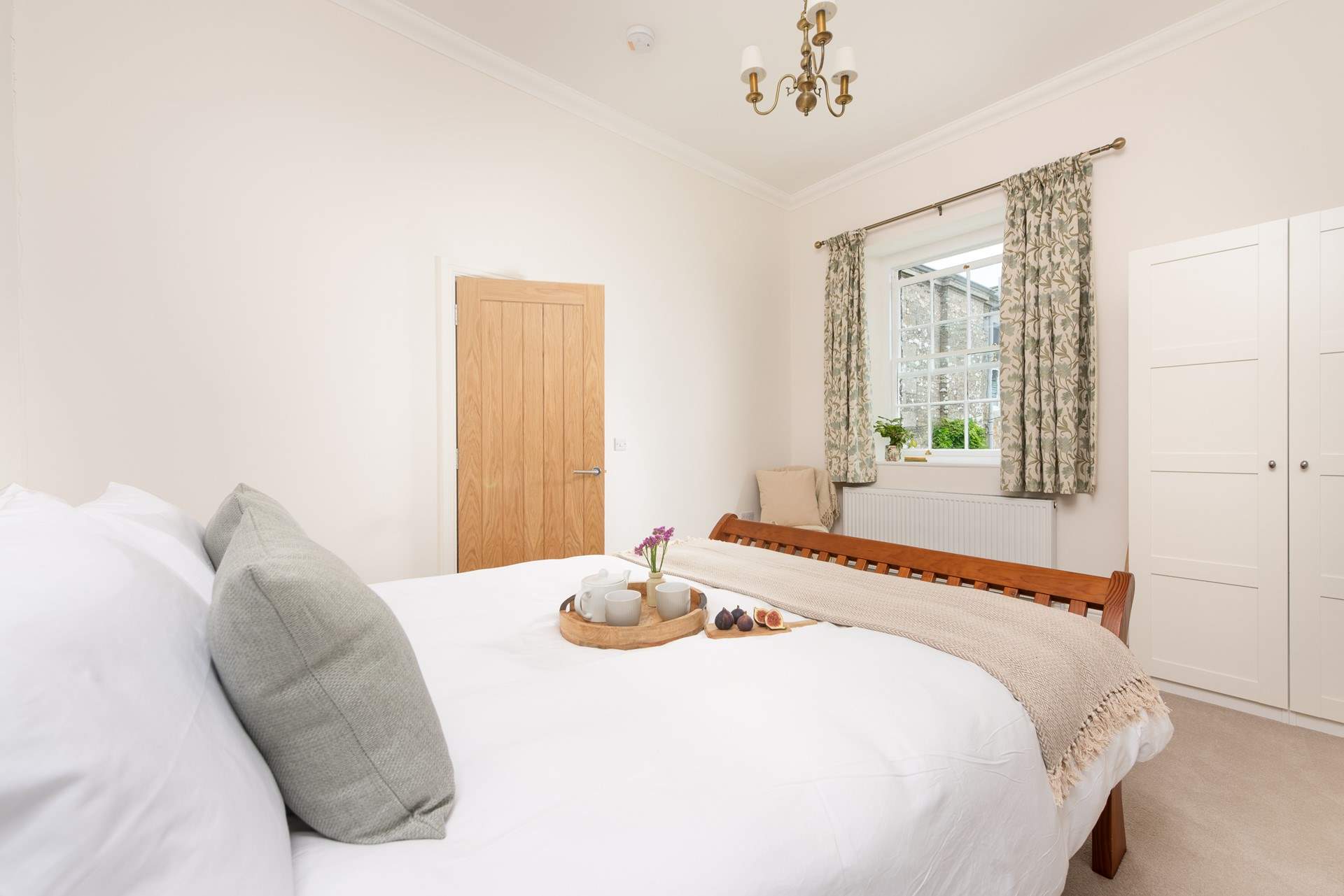 Snuggle up under covers of the king-size bed.