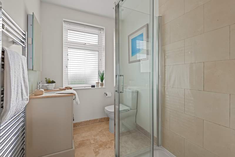 The en suite in bedroom 1 has that all-important shower to wash away those sandy toes!