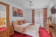 Bedroom one is bright and welcoming.