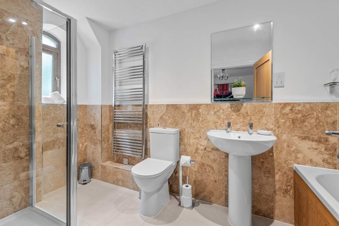 The en suite bathroom with shower cubicle for bedroom one.