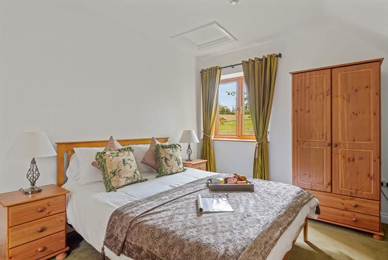 Bedroom four is homely and inviting with wonderful countryside views.