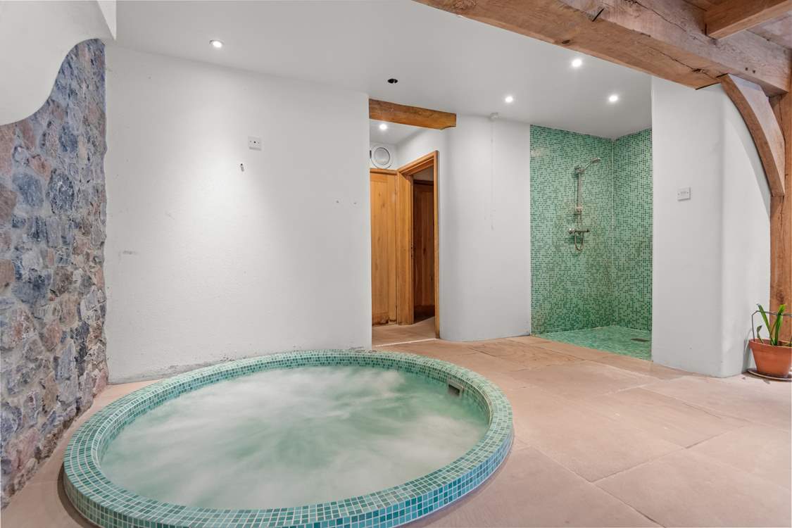 Wind down as you sink into the bubbles in the fabulous jacuzzi hot tub.