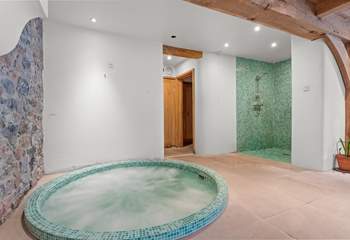 Wind down as you sink into the bubbles in the fabulous jacuzzi hot tub.