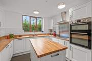 There is plenty of worktop space and storage space in this neat and compact kitchen-area.