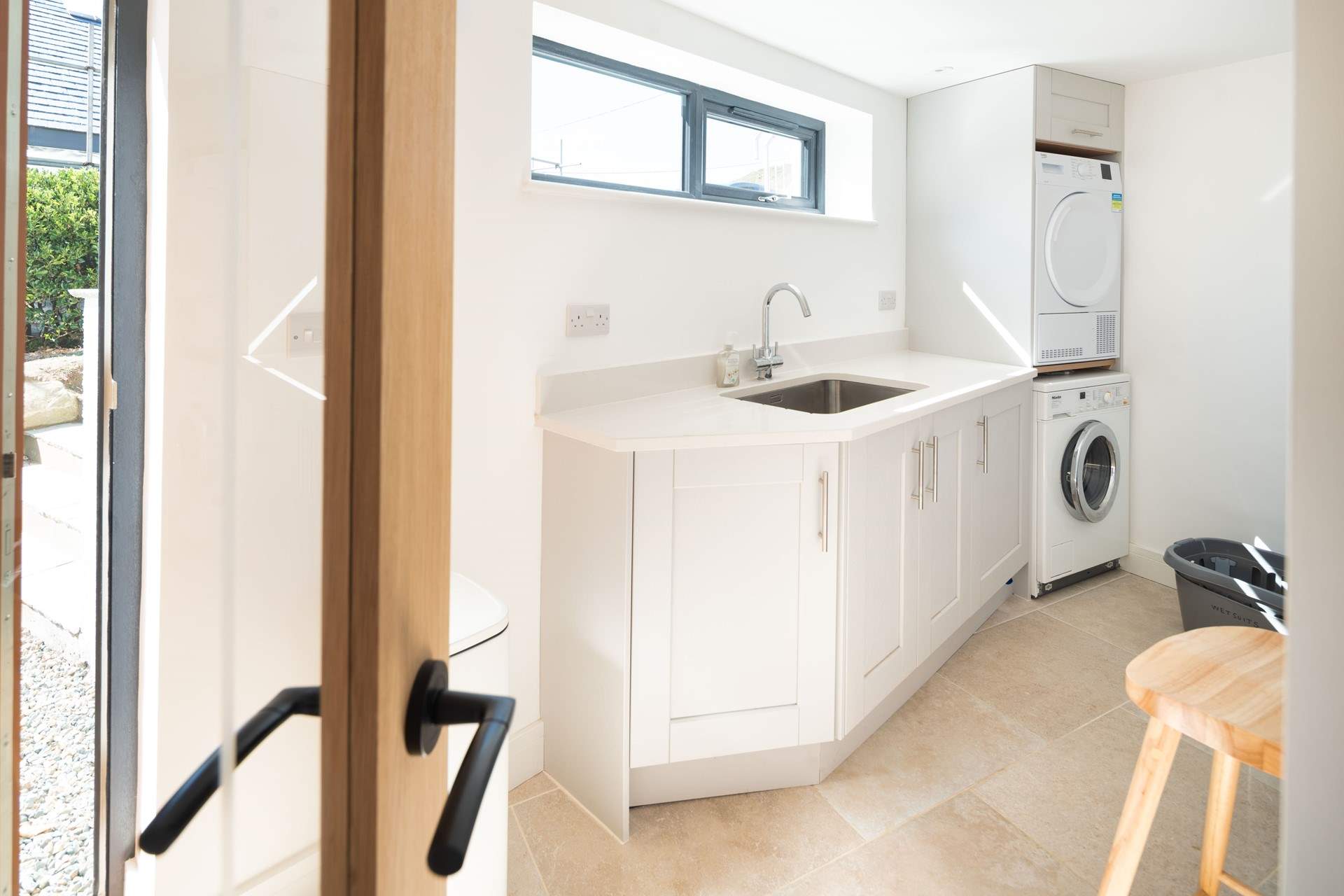 All you need in a utility-room, located on the lower ground floor. The outside shower, available during the summer months, is ideal for rinsing wetsuits and sandy dogs. 