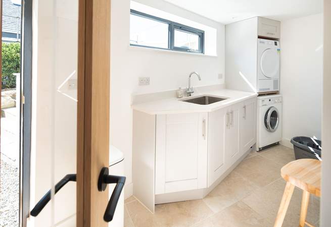 All you need in a utility-room, located on the lower ground floor. The outside shower, available during the summer months, is ideal for rinsing wetsuits and sandy dogs. 