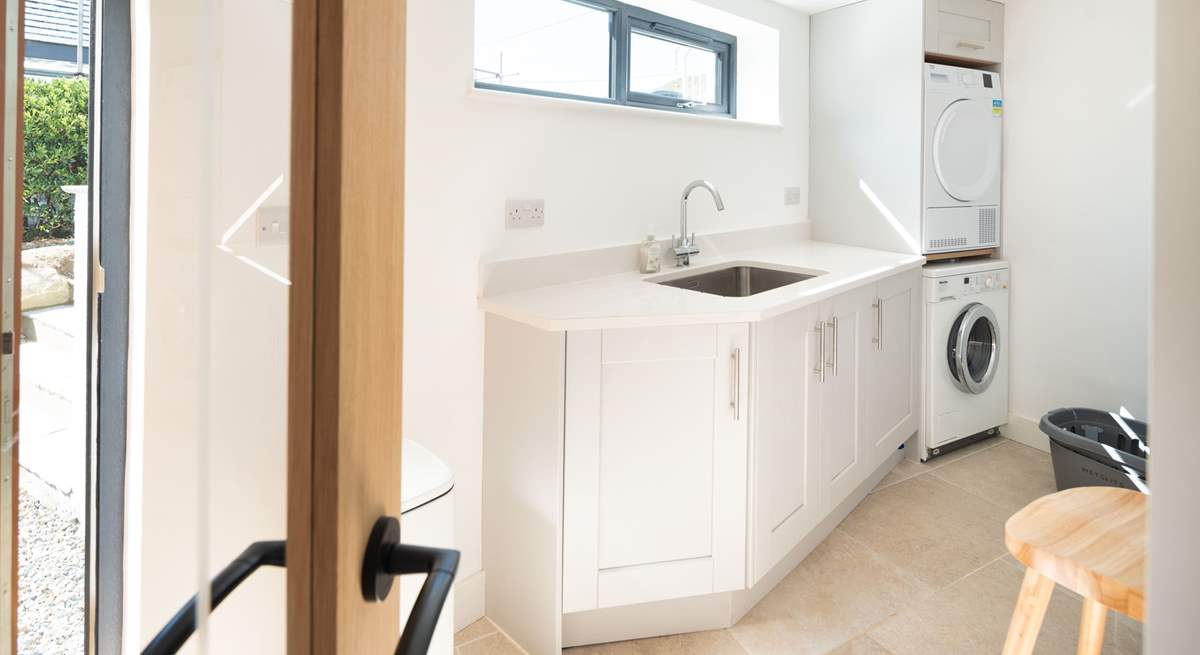 All you need in a utility-room, located on the lower ground floor. The outside shower, available during the summer months, is ideal for rinsing wetsuits and sandy dogs. 