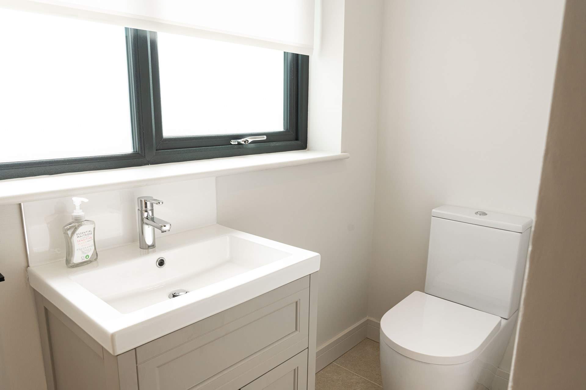 Convenient cloakroom on the lower ground floor.