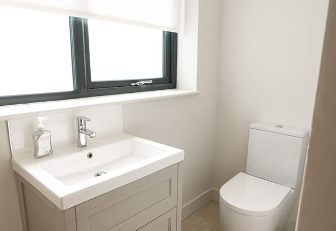 Convenient cloakroom on the lower ground floor.