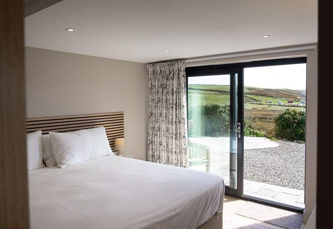 Enjoy panoramic sea views and access to the patio from the lower ground floor.