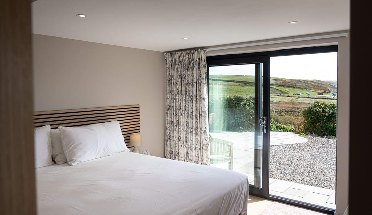 Enjoy panoramic sea views and access to the patio from the lower ground floor.