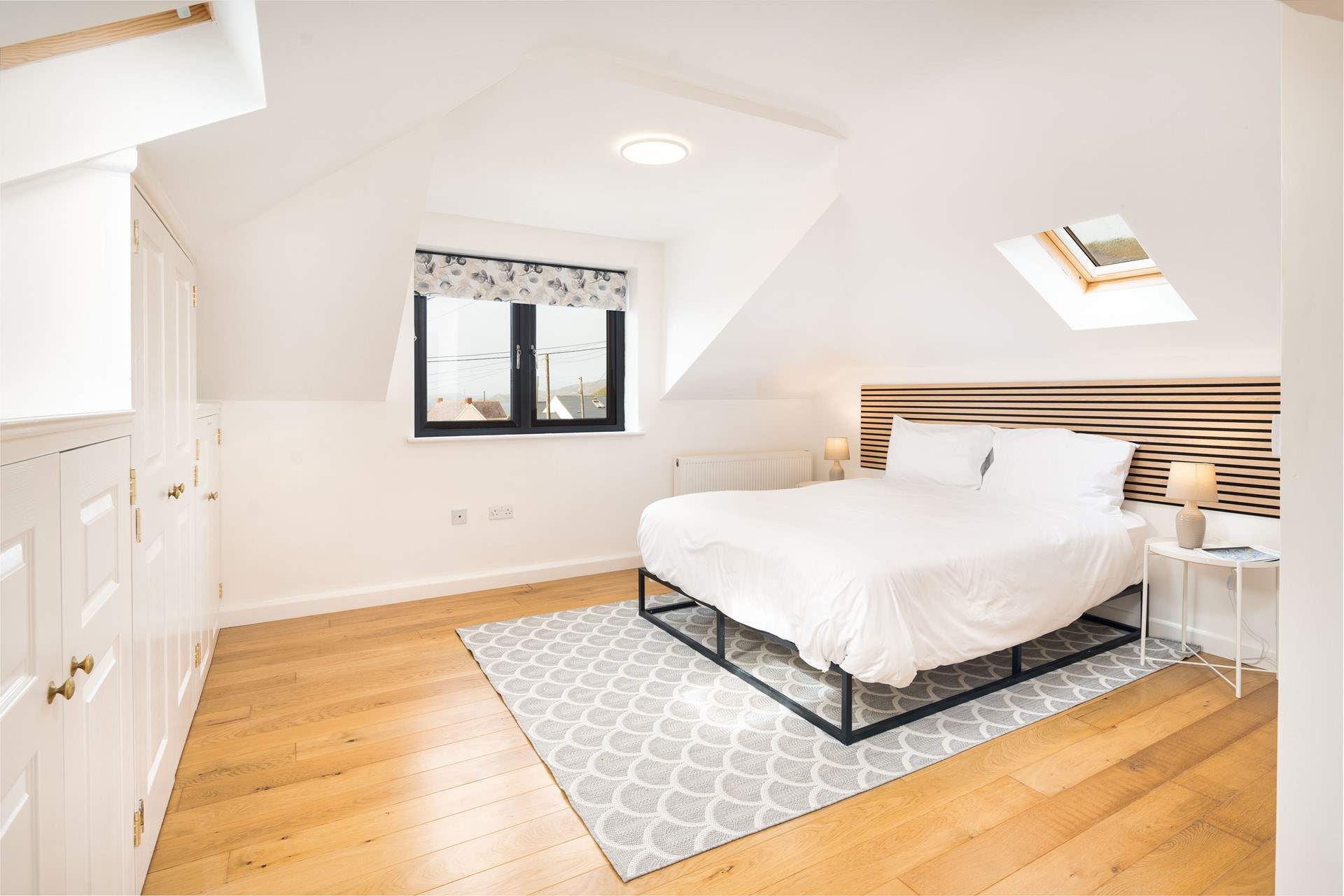 Spacious Bedroom 5 on the first floor with en suite cloakroom and wonderful ocean views. The family bathroom is just at the foot of the stairs. 