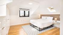 Spacious Bedroom 5 on the first floor with en suite cloakroom and wonderful ocean views. The family bathroom is just at the foot of the stairs. 